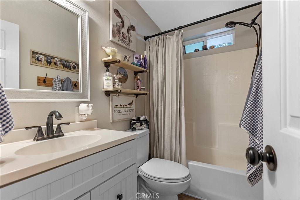 17500 High Gun Drive Tehachapi, CA 93561 - Photo 34 of 46 a bathroom with a sink toilet and shower