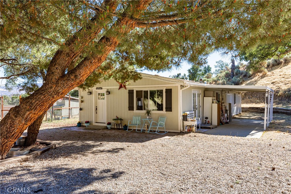 17500 High Gun Drive Tehachapi, CA 93561 - Photo 4 of 46 a front view of a house with a yard covered in snow