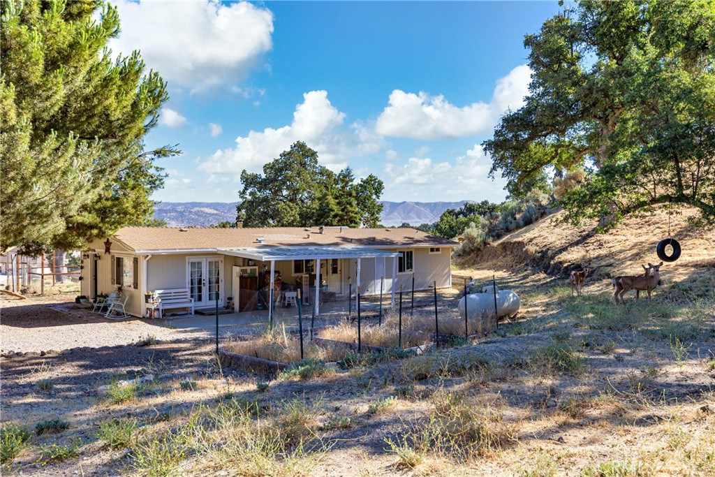 17500 High Gun Drive Tehachapi, CA 93561 - Photo 41 of 46 a view of a house with a yard
