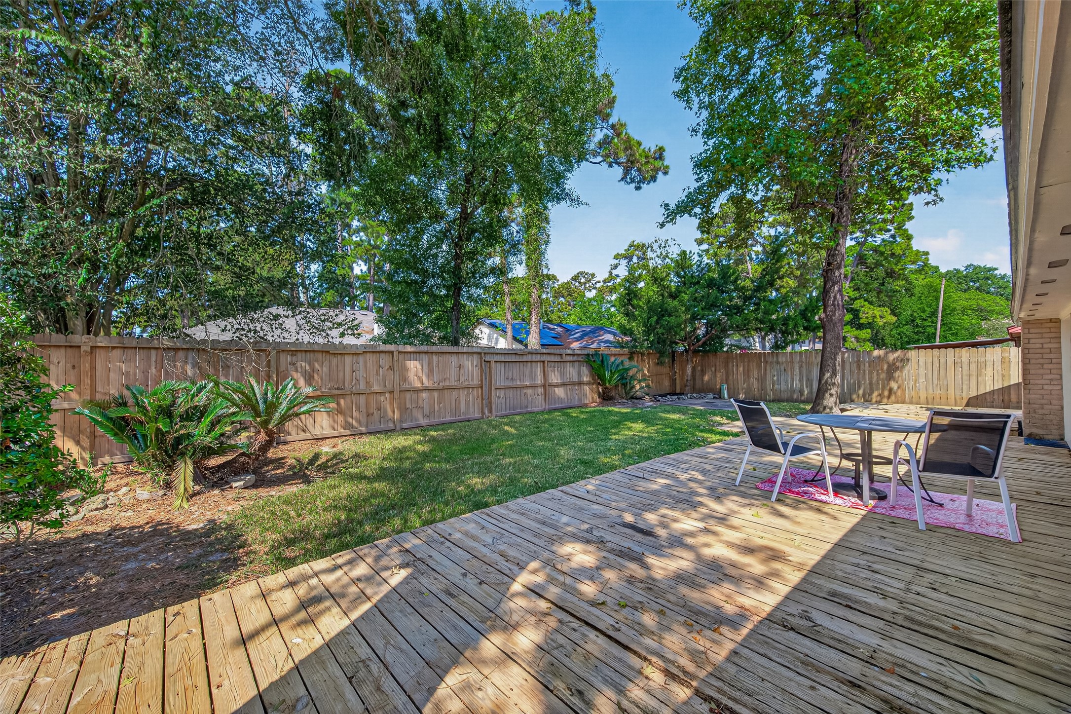 23219 Calico Corners Lane Spring, TX 77373 - Photo 23 of 24 Backyard features lots of shade from the towering trees.