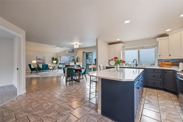 a kitchen with lots of counter top space and appliances