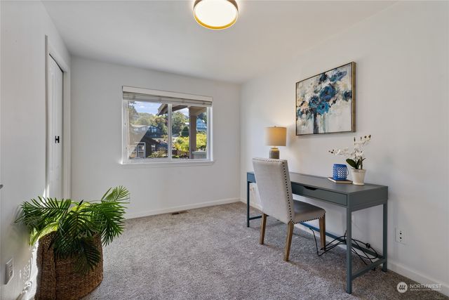 a workspace with furniture and window