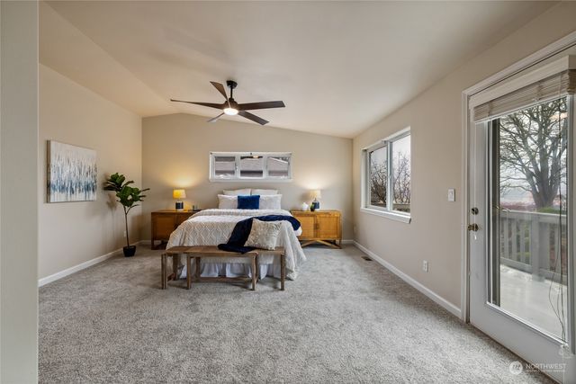 a bedroom with furniture and a window
