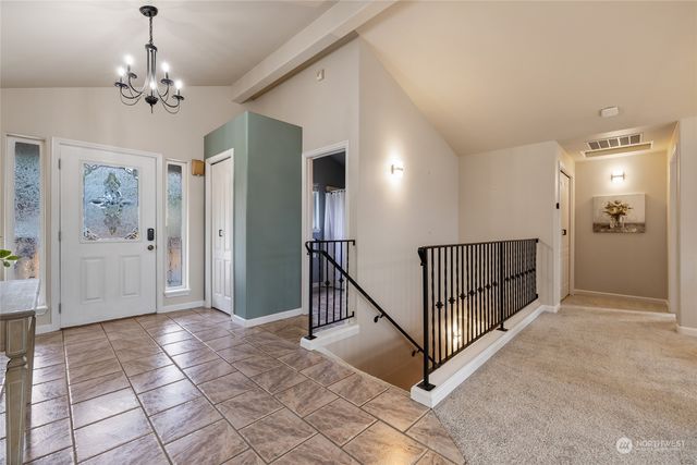 a view of a hallway view with staircase