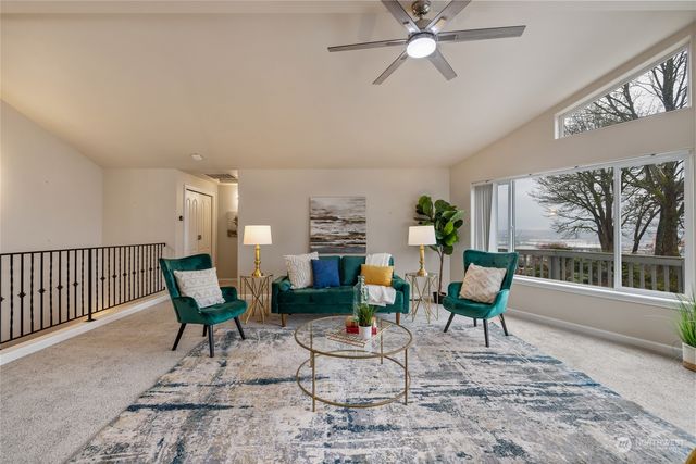 a living room with fireplace furniture and a wooden floor