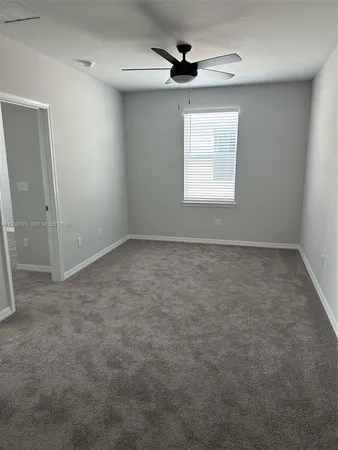 a view of kitchen with stainless steel appliances granite countertop refrigerator stove microwave and cabinets