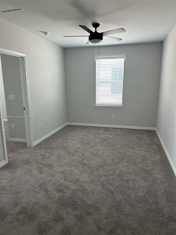 a view of kitchen with stainless steel appliances granite countertop refrigerator stove microwave and cabinets