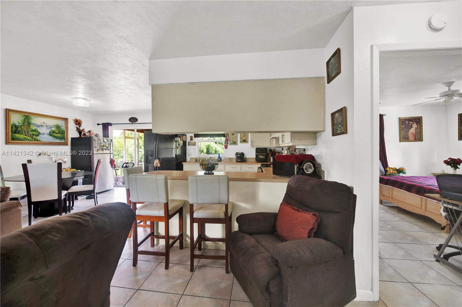 1480 Southwest 17th Street Naples, FL 34117 - Photo 13 of 36 a living room with furniture and a wooden floor