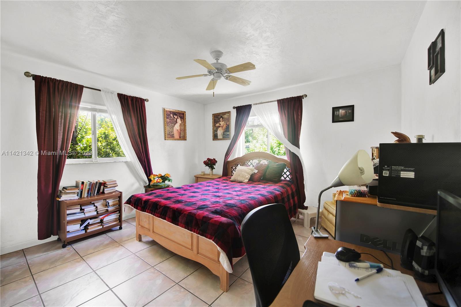 1480 Southwest 17th Street Naples, FL 34117 - Photo 15 of 36 a bedroom with a bed and a window