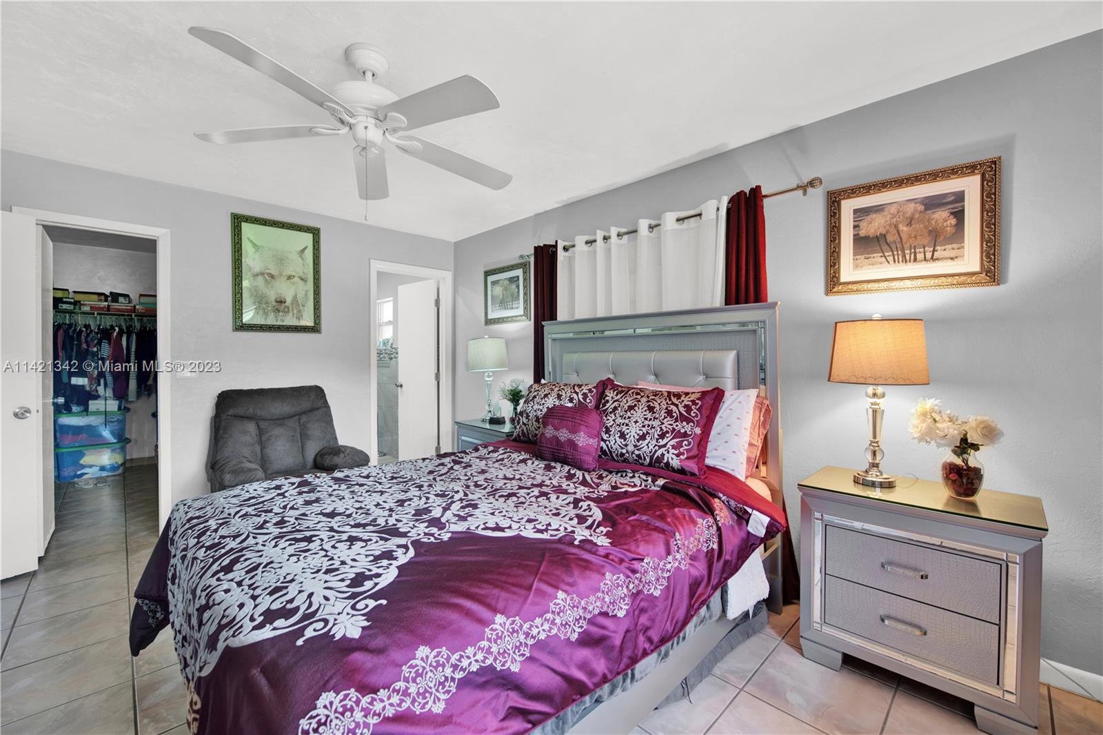 1480 Southwest 17th Street Naples, FL 34117 - Photo 20 of 36 a bedroom with a bed and wooden floor