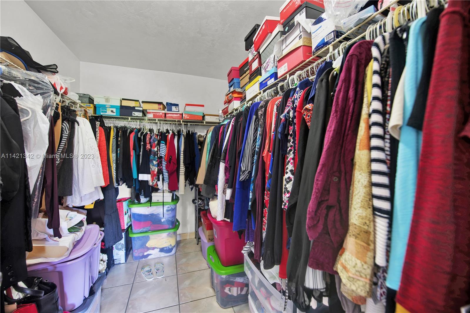 1480 Southwest 17th Street Naples, FL 34117 - Photo 21 of 36 a view of walk in closet with clothes