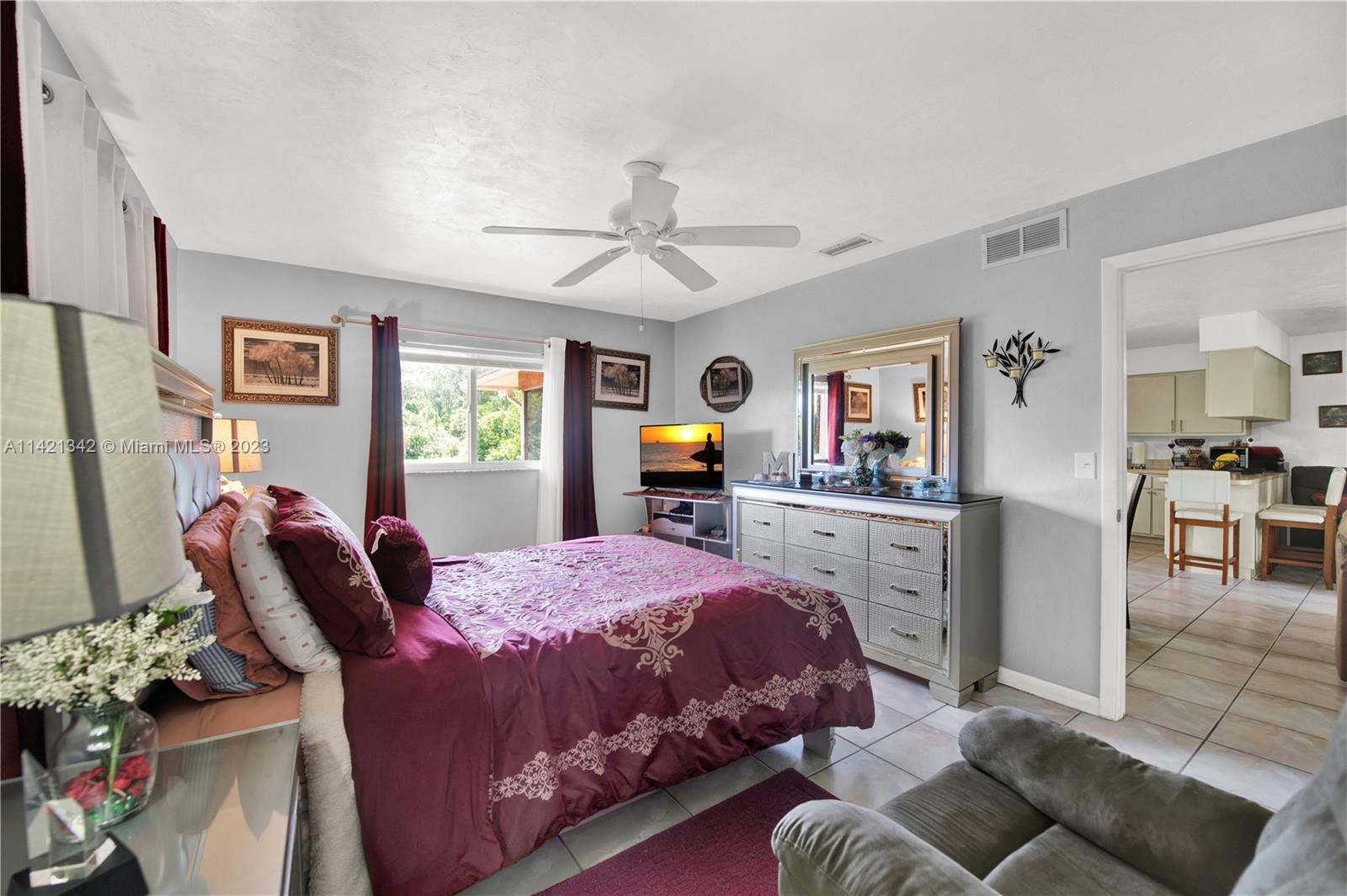 1480 Southwest 17th Street Naples, FL 34117 - Photo 24 of 36 a bedroom with a bed and furniture