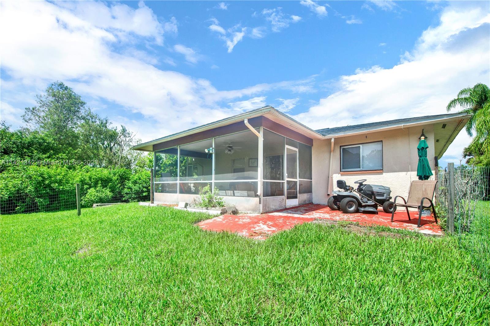 1480 Southwest 17th Street Naples, FL 34117 - Photo 28 of 36 a view of a house with a yard porch and sitting area