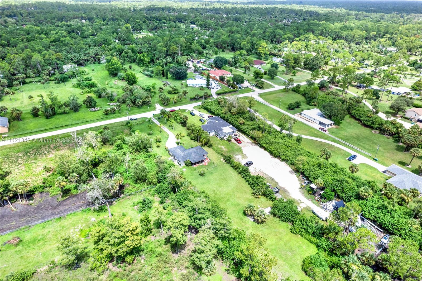 1480 Southwest 17th Street Naples, FL 34117 - Photo 33 of 36 a view of a city with lush green forest