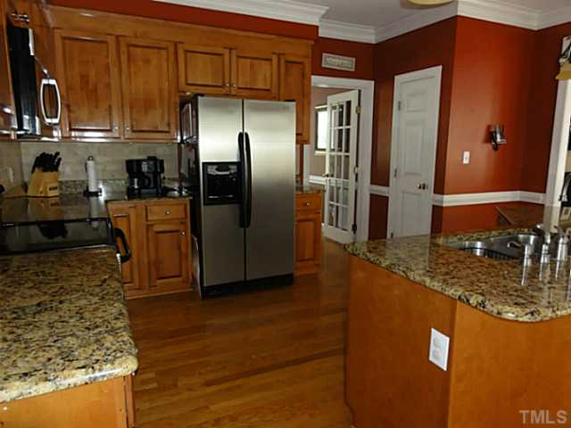 9408 Stone Mountain Road Raleigh, NC 27613 - Photo 13 of 25 Tiled backsplash too. Huge walk-in pantry. Kitchen