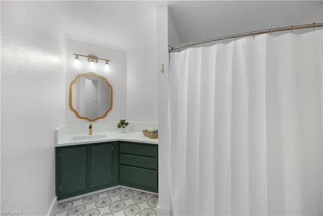 a bathroom with a sink and a mirror