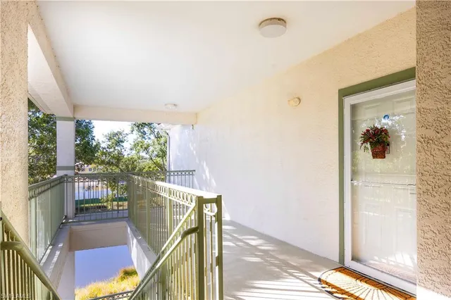 a view of a balcony with wooden floor