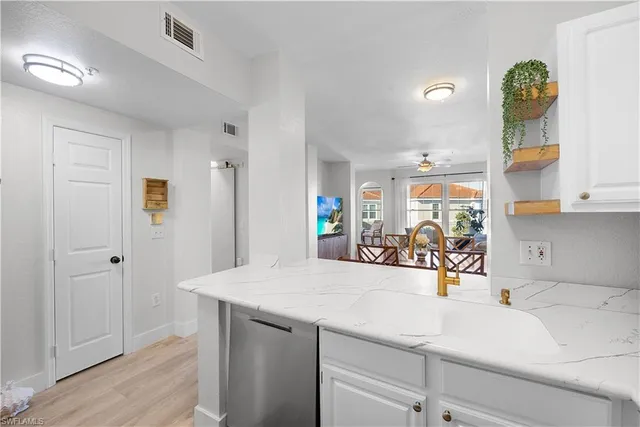 a view of a kitchen from the hallway
