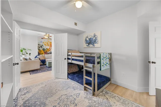 a bedroom with furniture and a rug