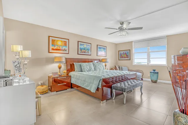 a bedroom with a bed and flat screen tv