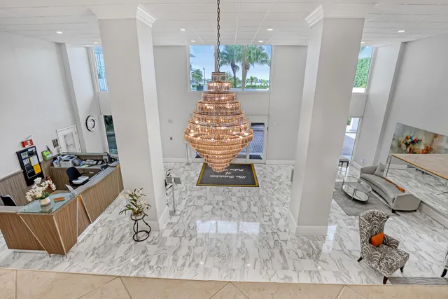a living room with furniture and a book shelf