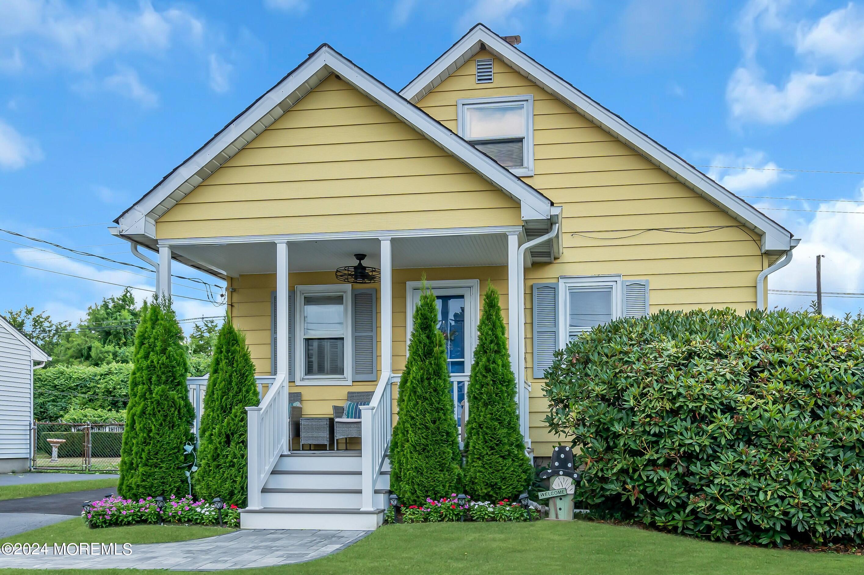 a view of a house in front of a yard