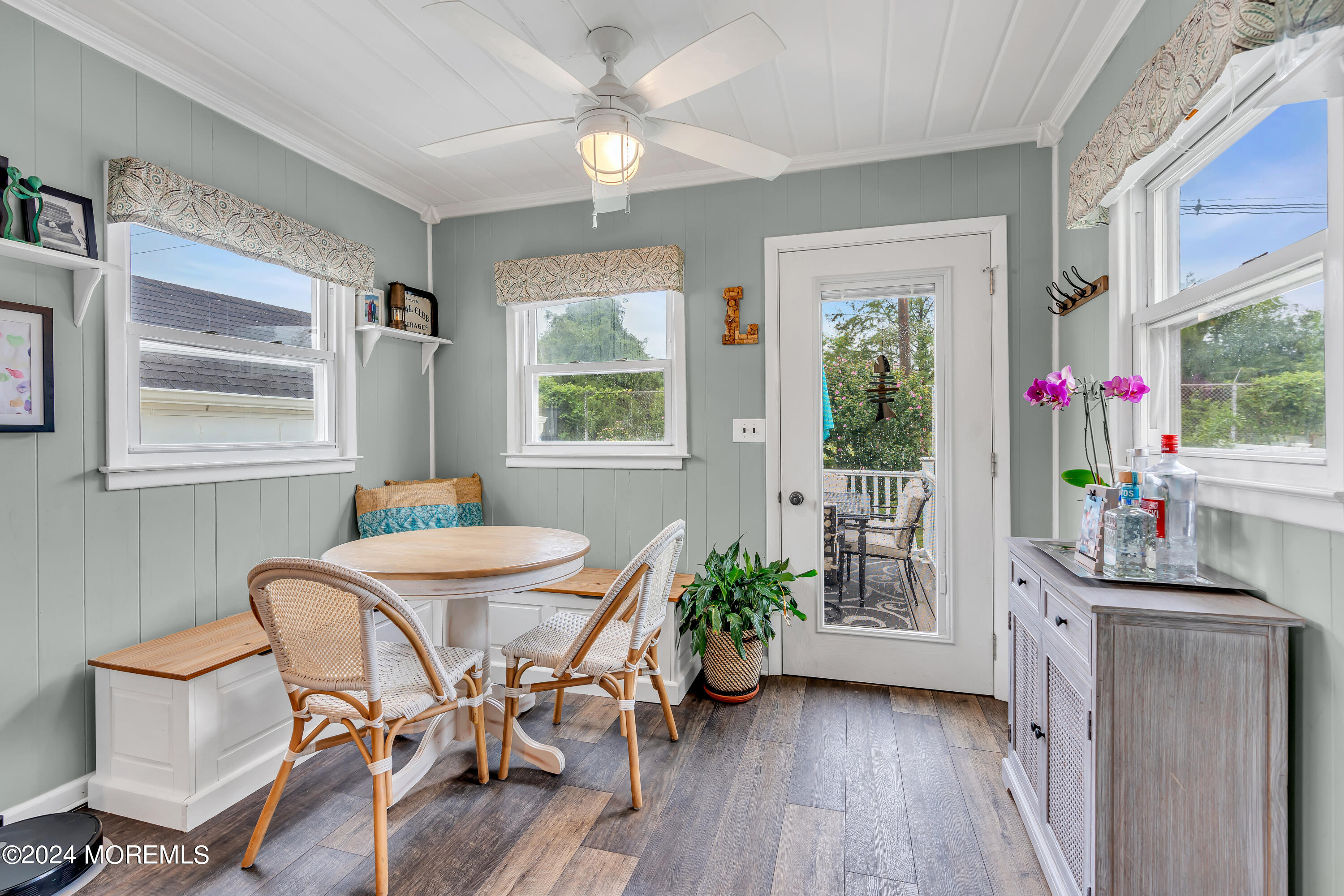 1507 Edgemere Road Wall, NJ 07719 - Photo 15 of 32 a dining room with furniture potted plants and wooden floor