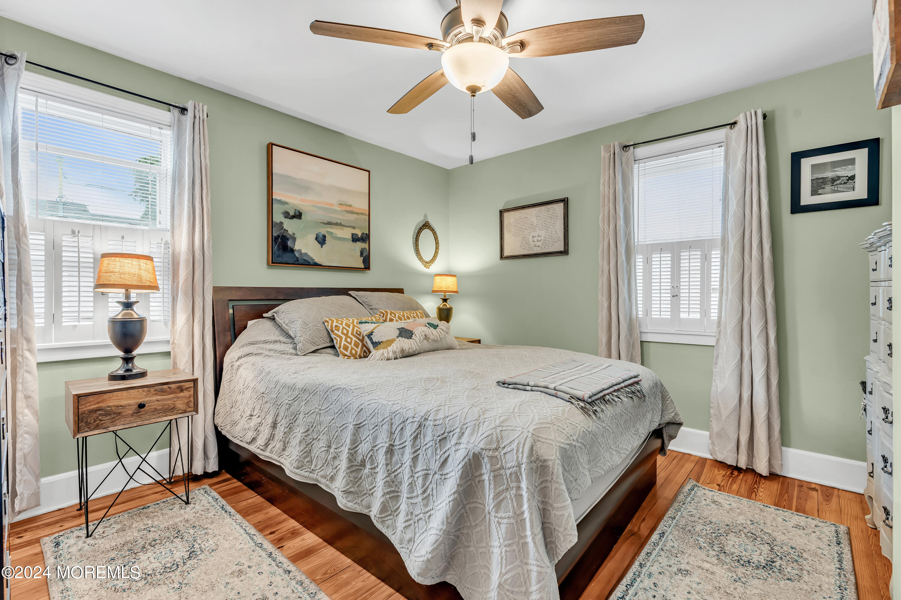 1507 Edgemere Road Wall, NJ 07719 - Photo 16 of 32 a bedroom with a bed and a chandelier