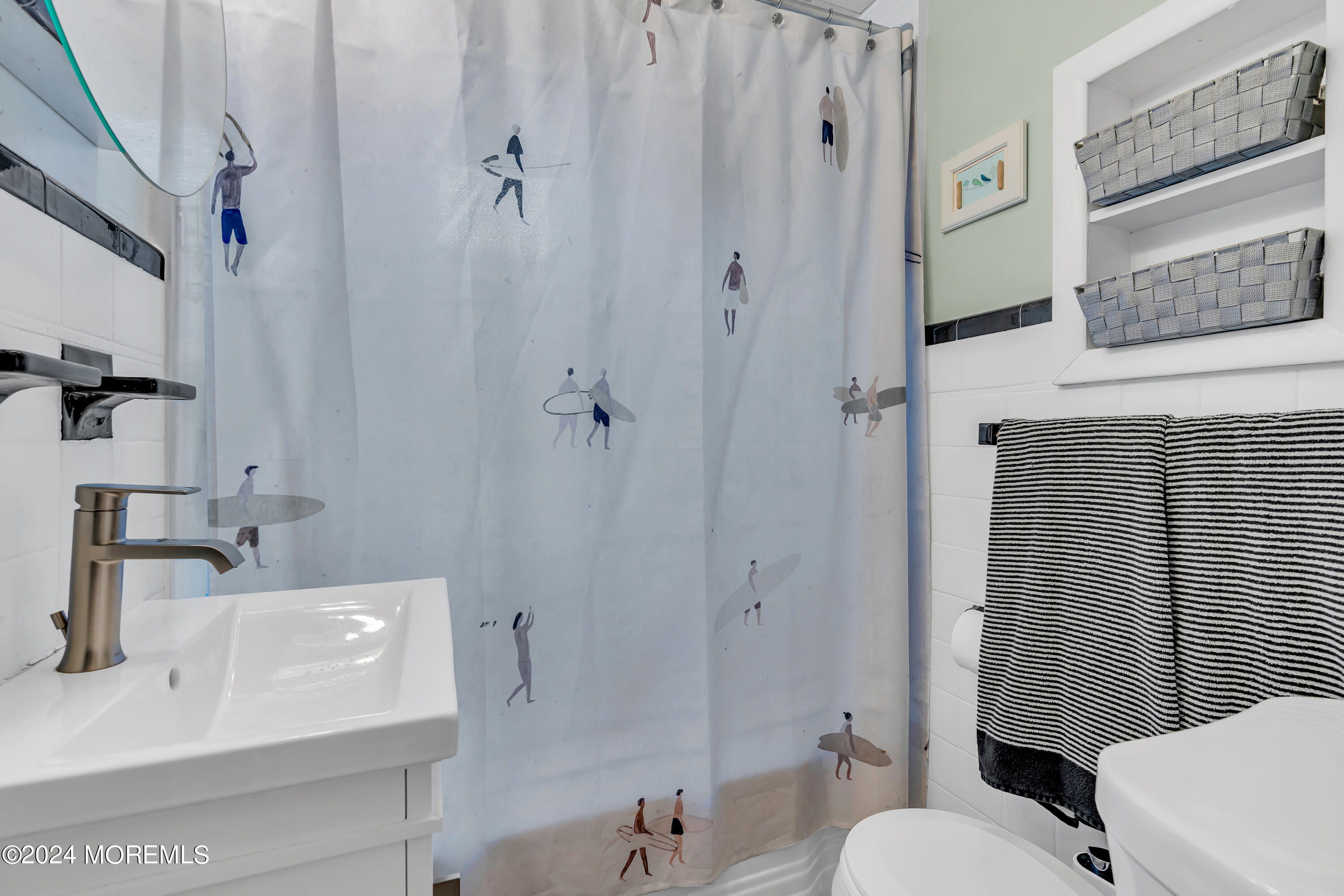 1507 Edgemere Road Wall, NJ 07719 - Photo 19 of 32 a bathroom with a sink a toilet and shower