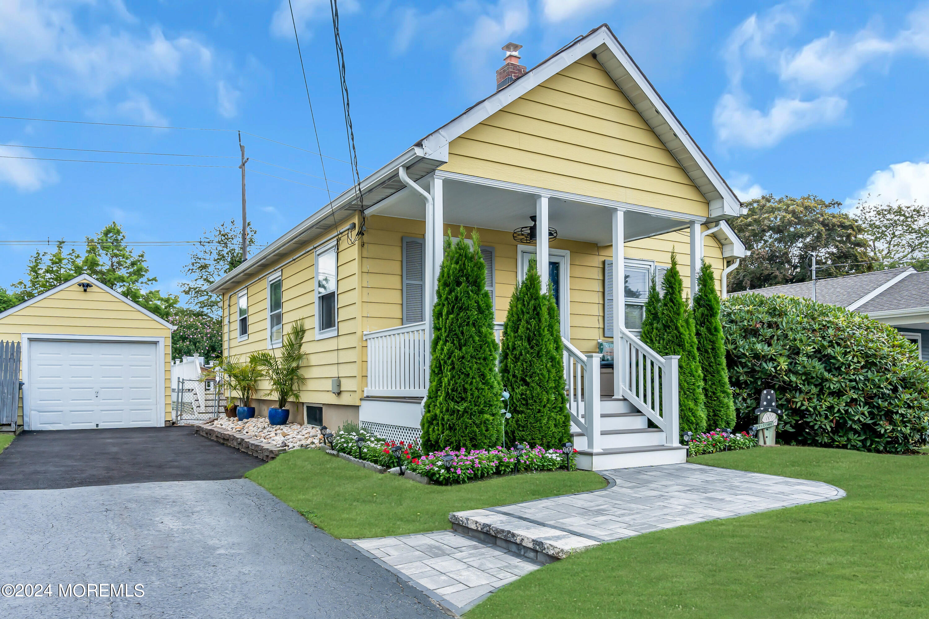1507 Edgemere Road Wall, NJ 07719 - Photo 2 of 32 a front view of a house with a yard and potted plants