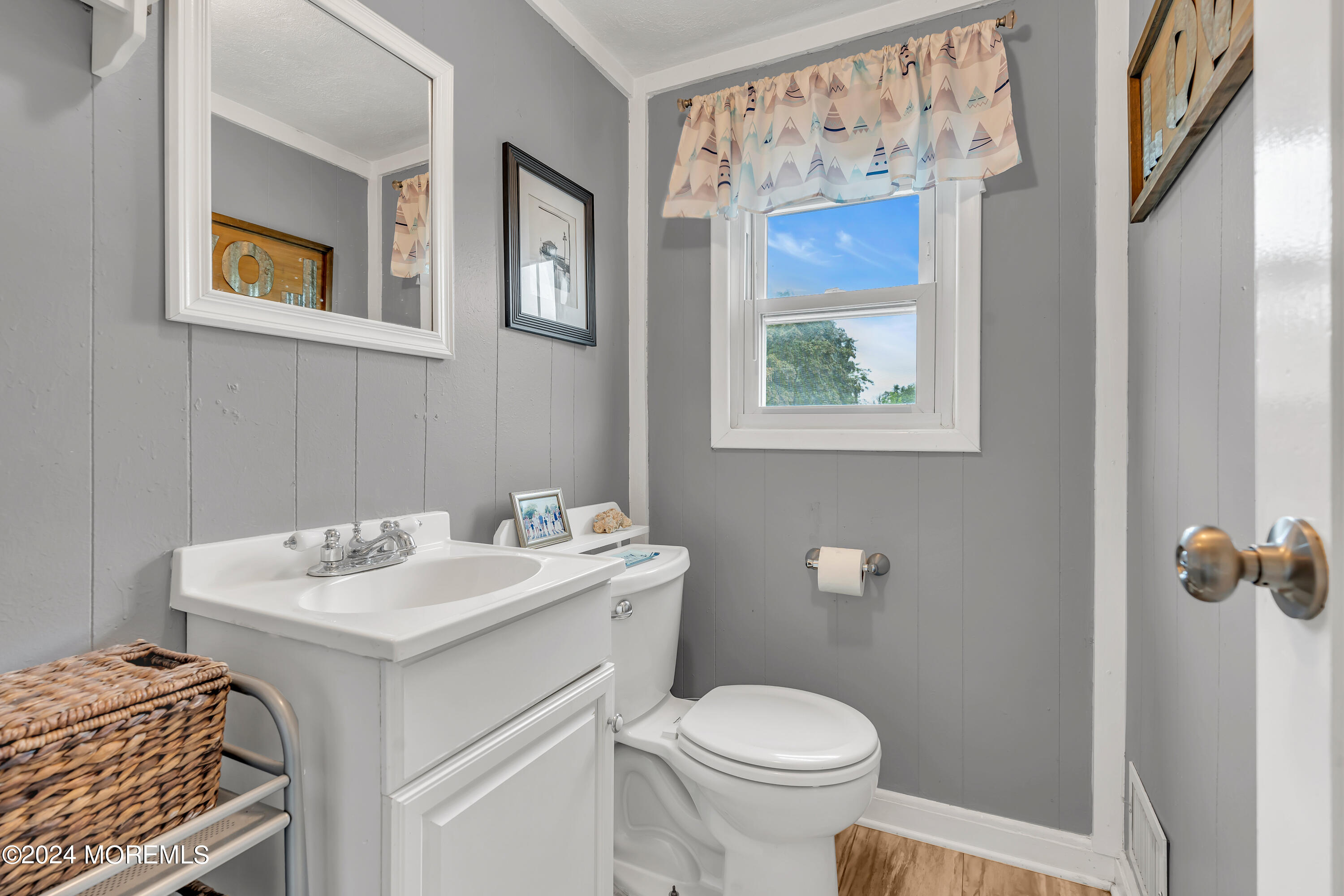 1507 Edgemere Road Wall, NJ 07719 - Photo 23 of 32 a bathroom with a sink toilet and mirror