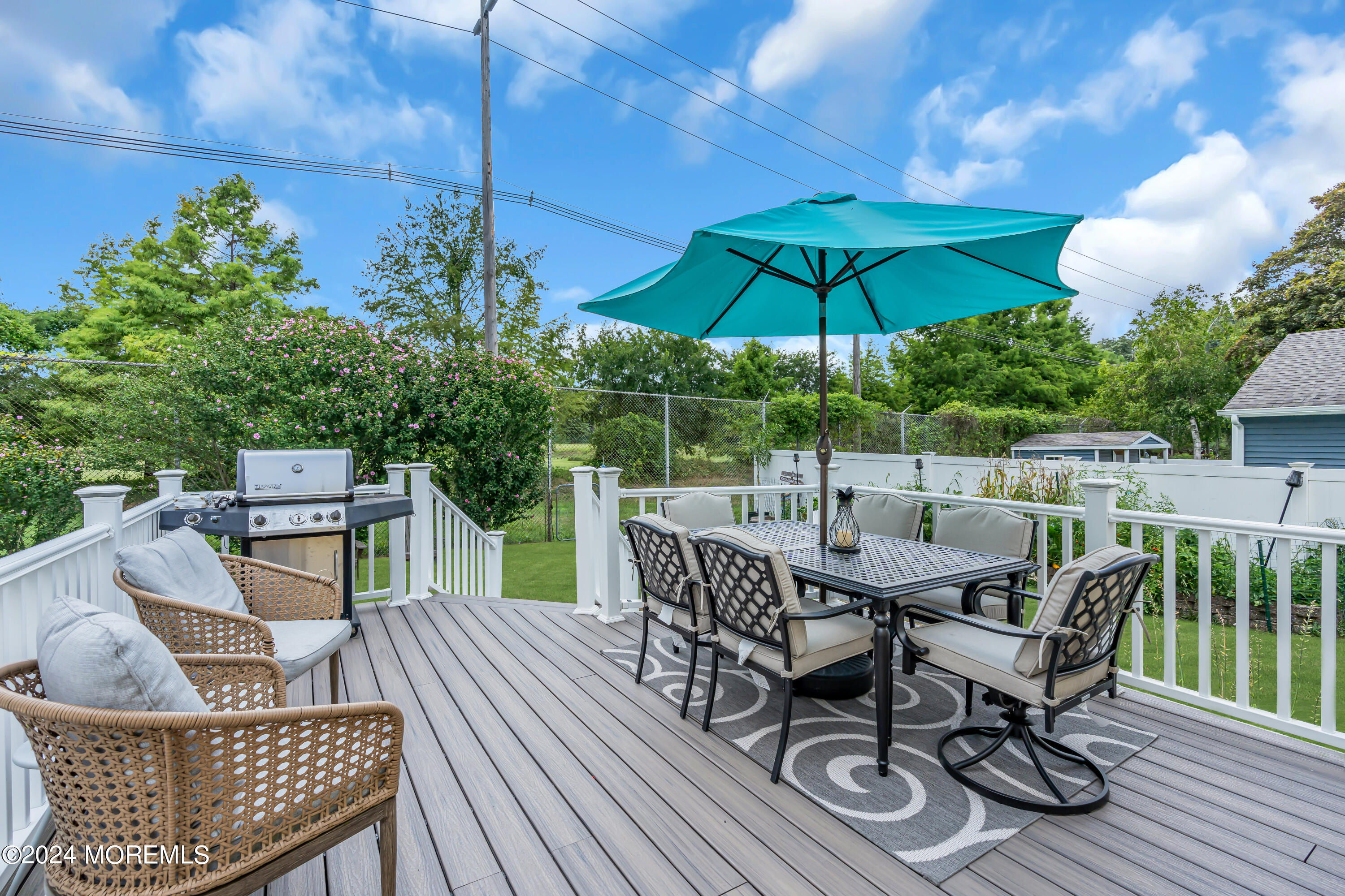 1507 Edgemere Road Wall, NJ 07719 - Photo 27 of 32 a view of balcony with furniture and umbrella