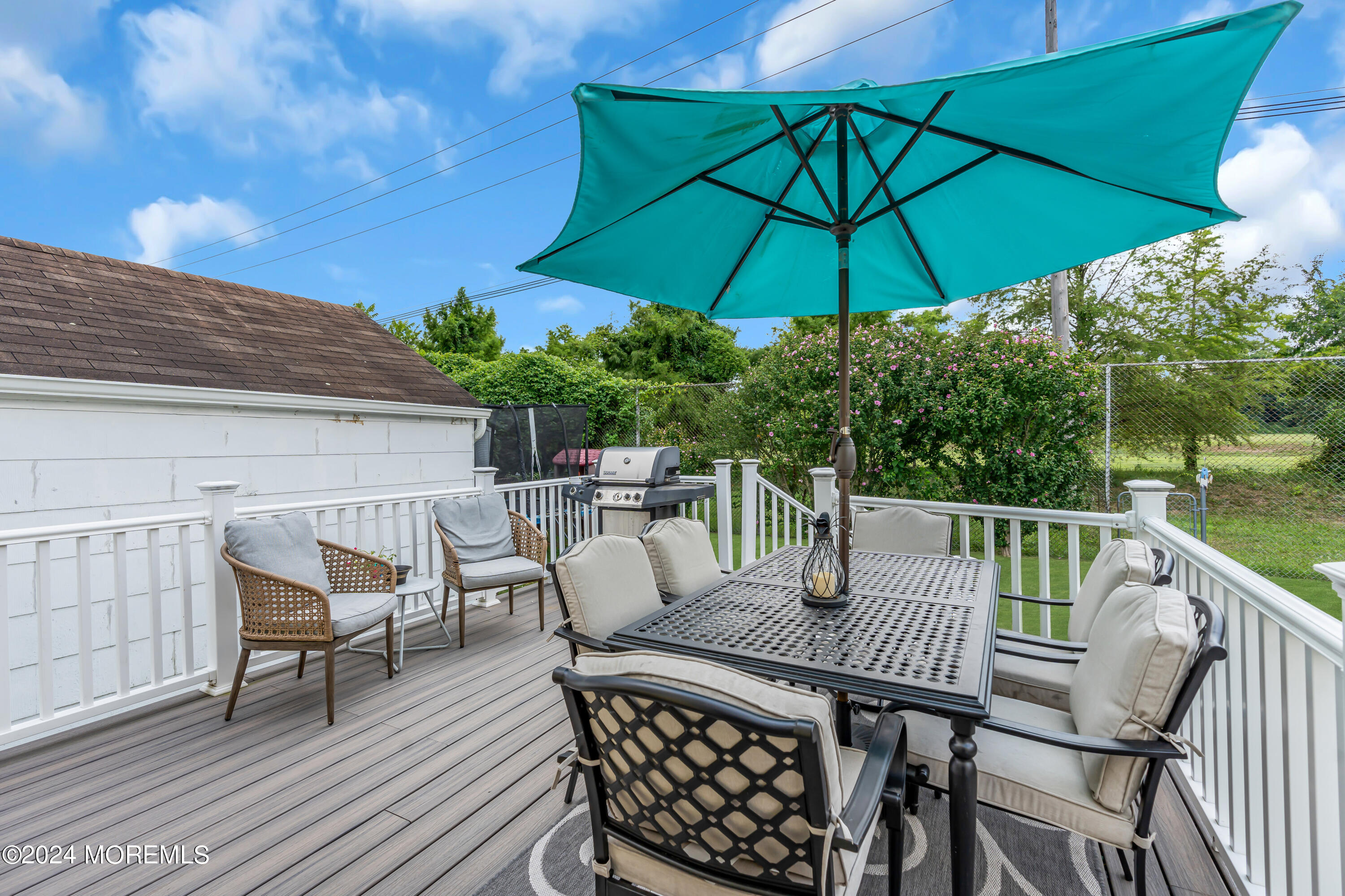 1507 Edgemere Road Wall, NJ 07719 - Photo 28 of 32 a view of balcony with outdoor seating and wooden floor