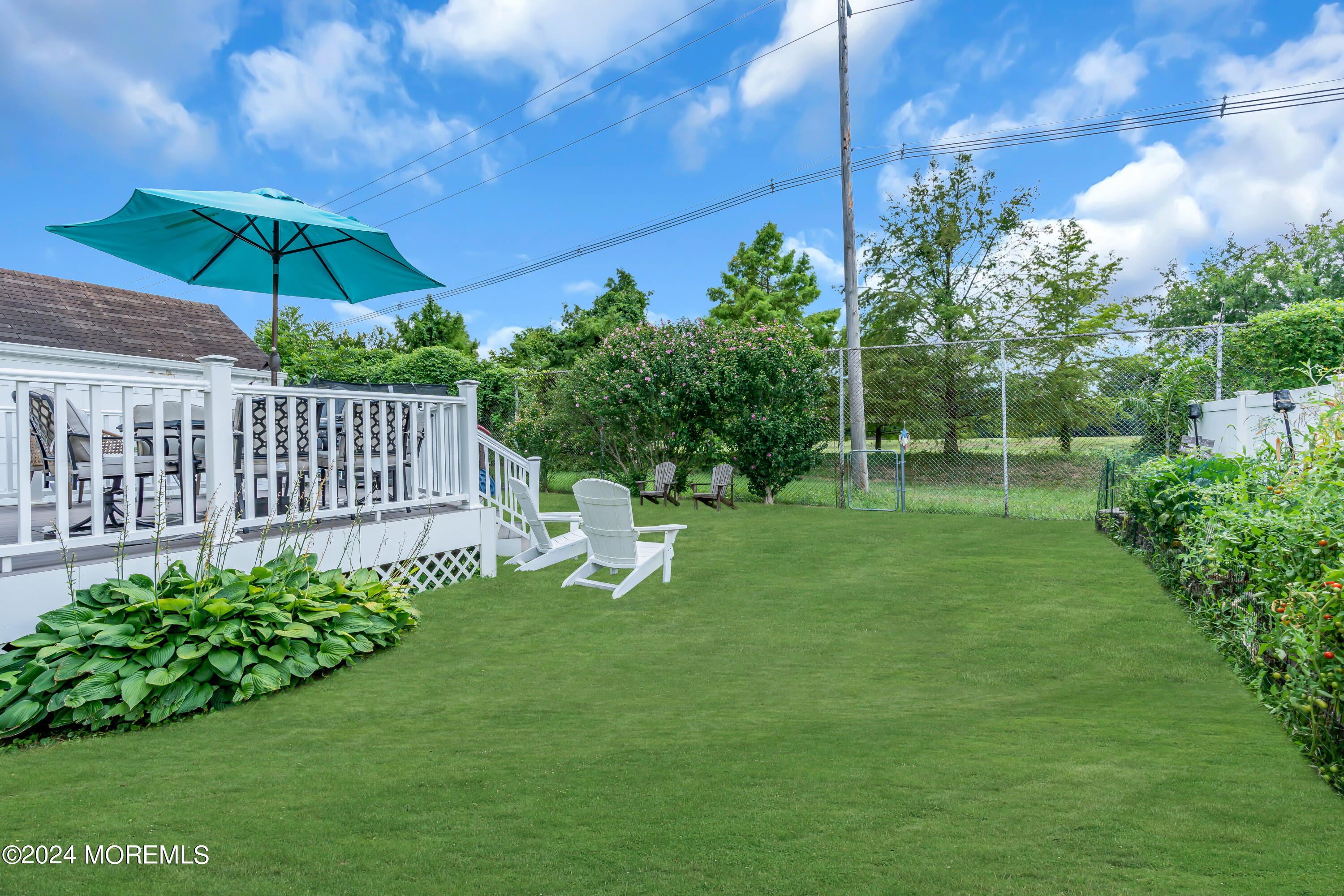 1507 Edgemere Road Wall, NJ 07719 - Photo 29 of 32 a view of a garden with a bench