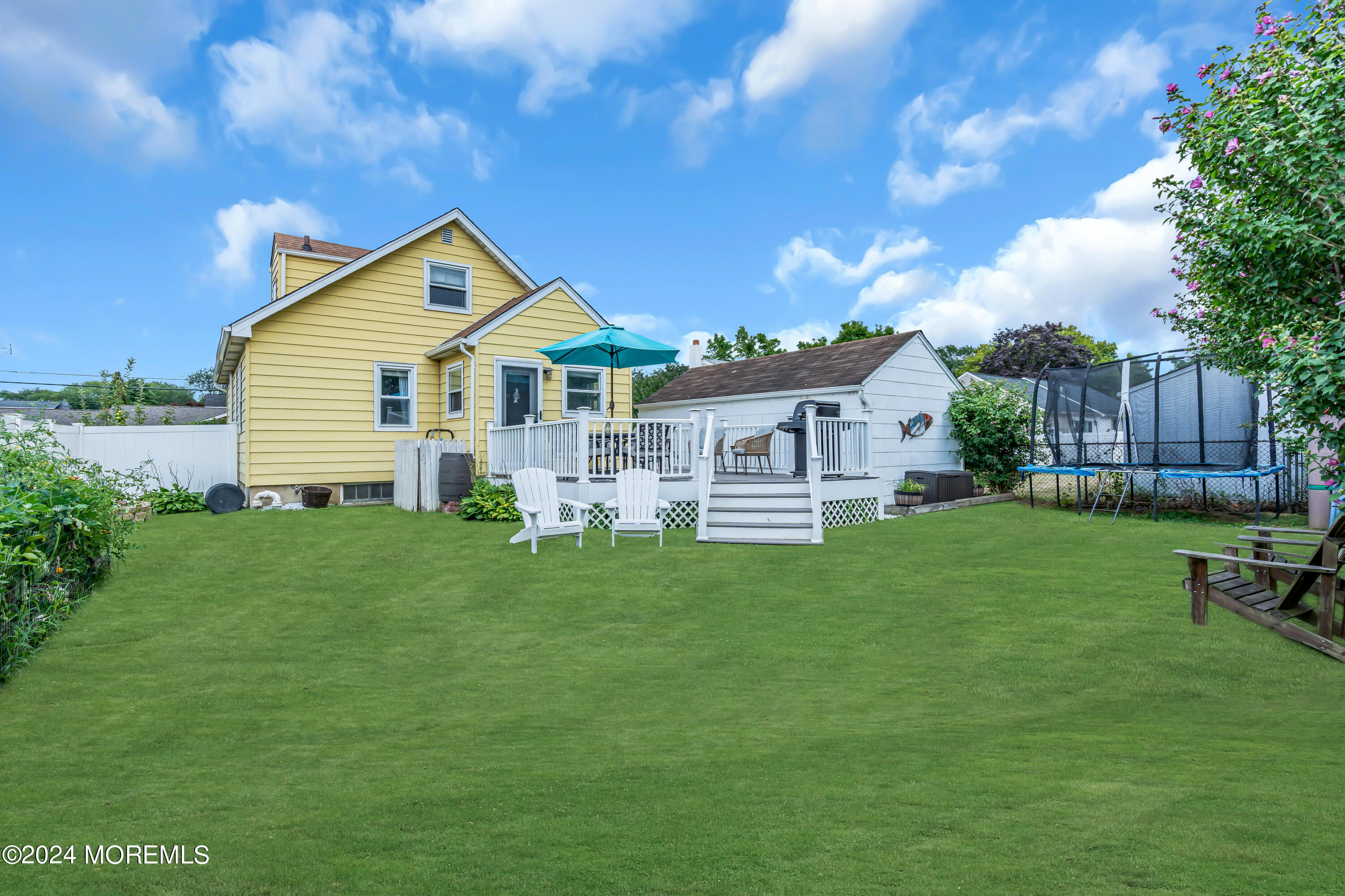 1507 Edgemere Road Wall, NJ 07719 - Photo 30 of 32 a view of a house with a backyard