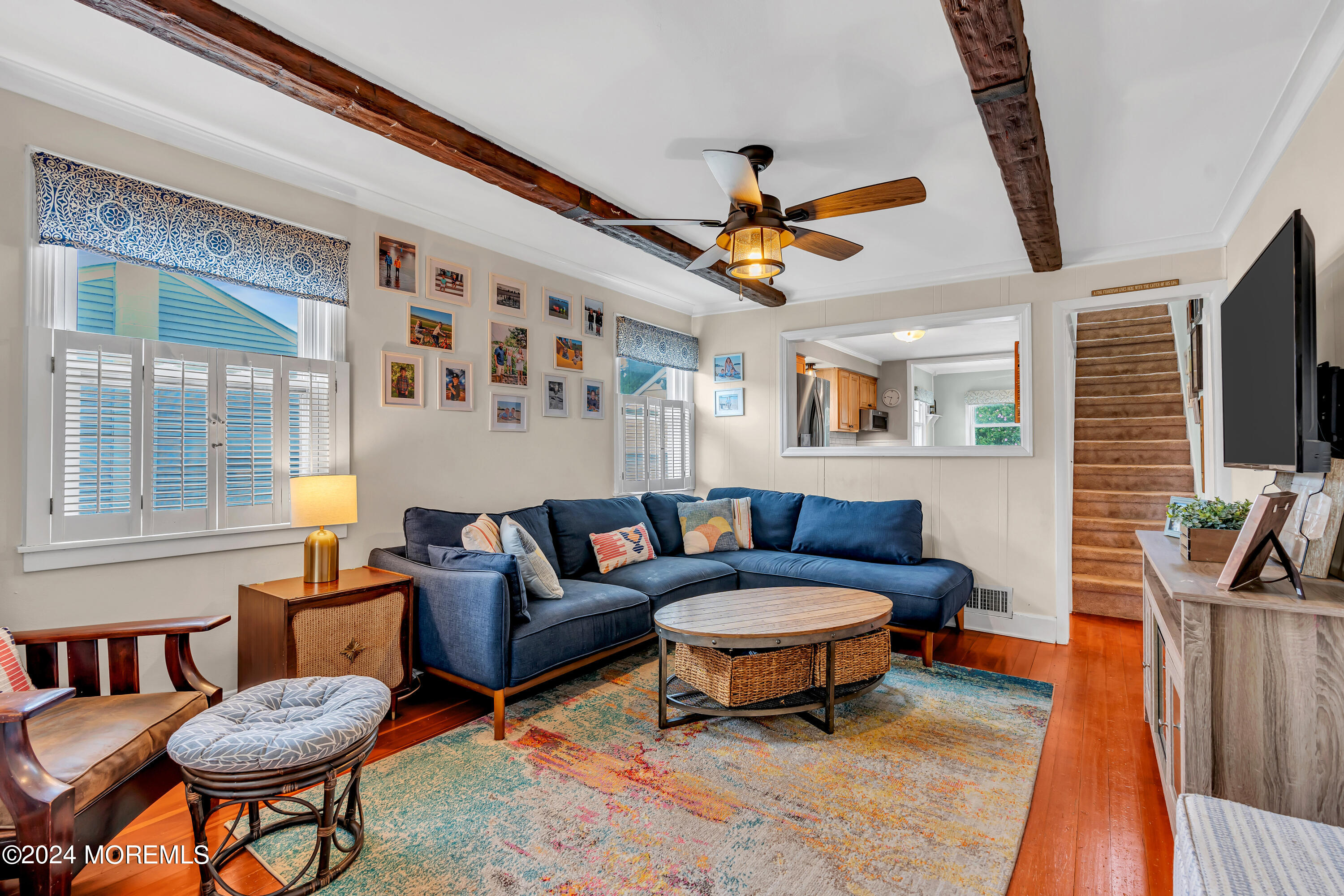 1507 Edgemere Road Wall, NJ 07719 - Photo 7 of 32 a living room with furniture a flat screen tv and a table