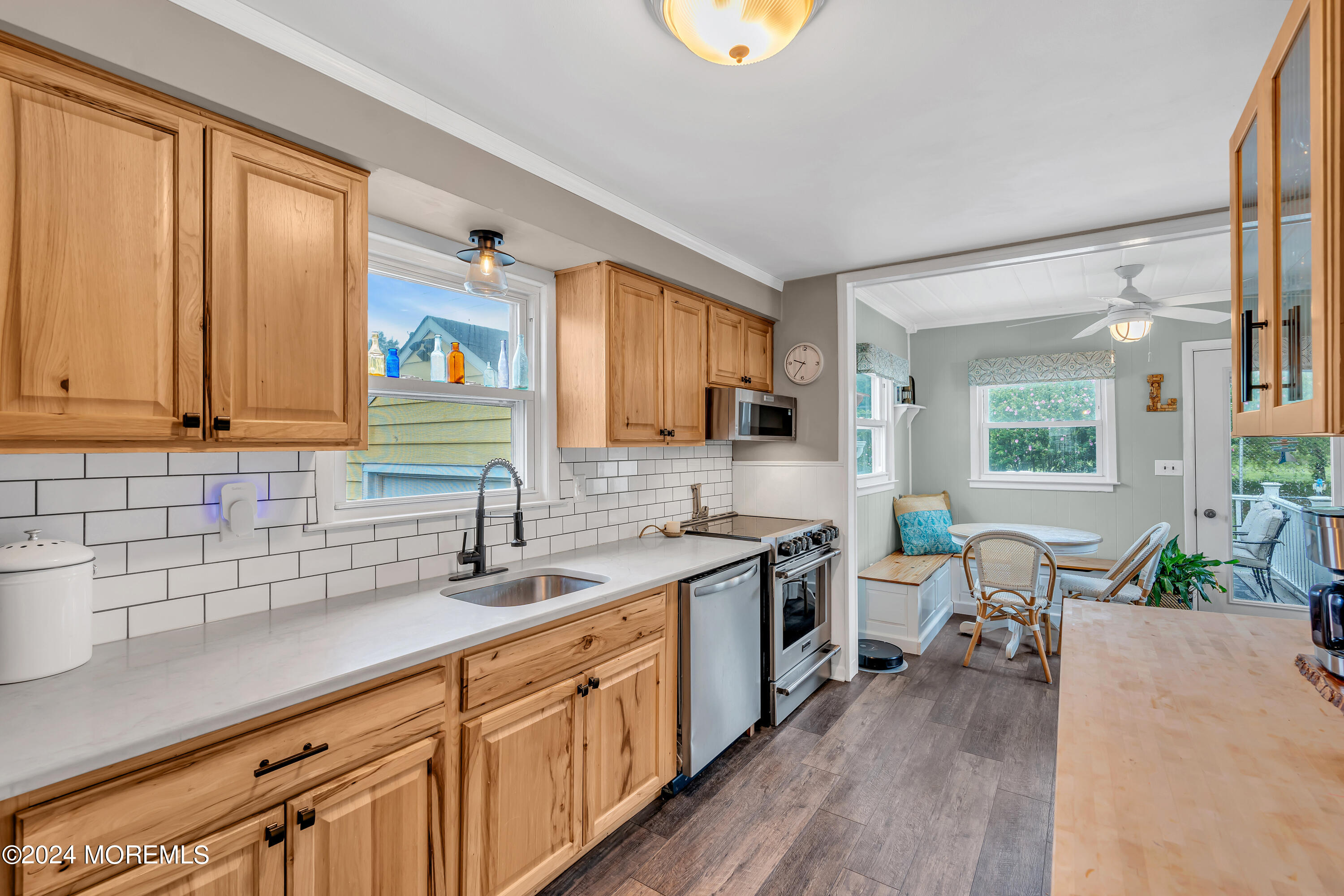 1507 Edgemere Road Wall, NJ 07719 - Photo 10 of 32 a kitchen with stainless steel appliances granite countertop a sink stove and cabinets