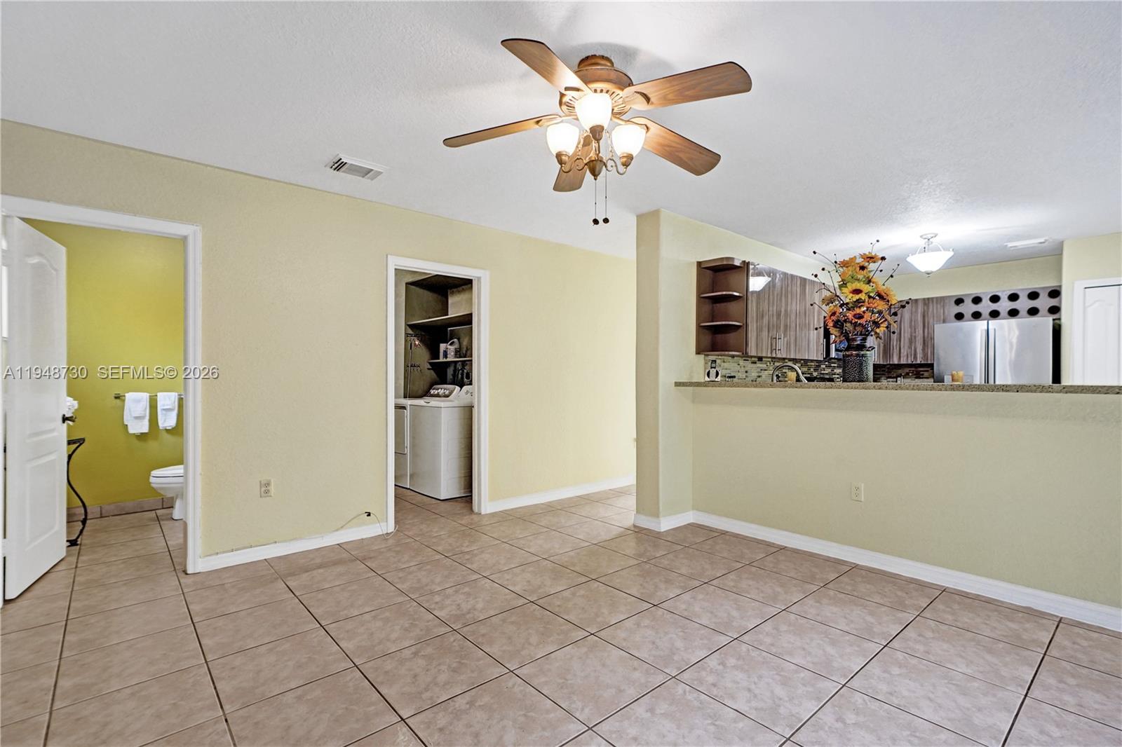 5502 Southwest 162nd Place Miami, FL 33185 - Photo 65 of 72 a view of a livingroom with a kitchen