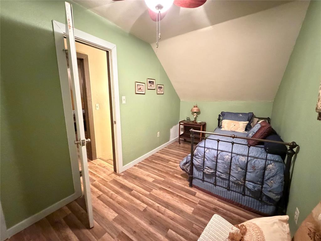330 South Goode Road Wilmer, TX 75172 - Photo 27 of 38 a bedroom with a bed and a dresser