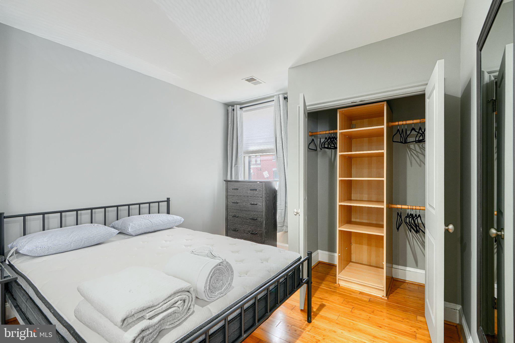 1018 North Charles Street, Unit R Baltimore, MD 21201 - Photo 8 of 17 Cozy bedroom with ample storage space.