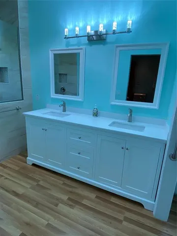 a bathroom with a sink and a mirror