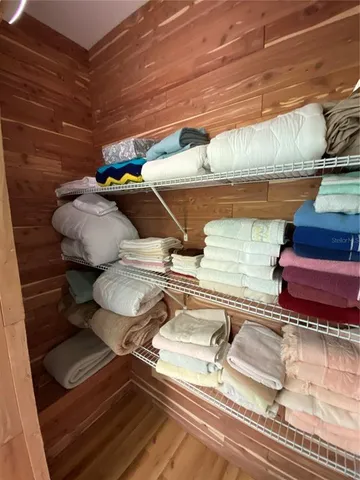 a large kitchen with stainless steel appliances kitchen island granite countertop a large counter top stainless steel appliances a window and kitchen view