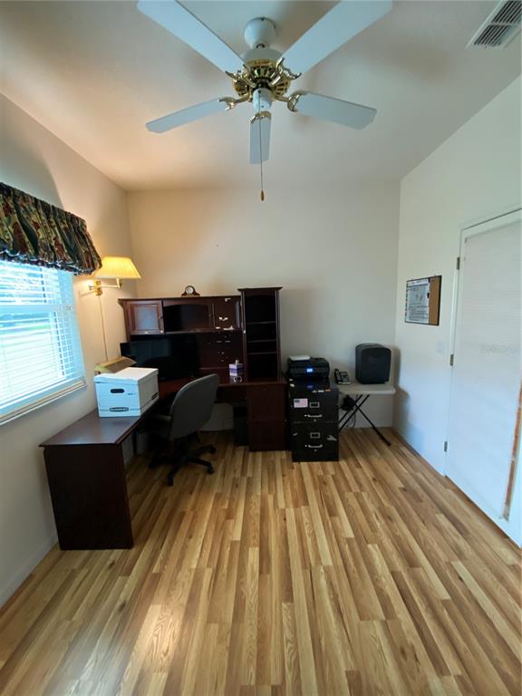 4202 Hammersmith Drive Clermont, FL 34711 - Photo 34 of 73 a bed room with a bed and a chandelier