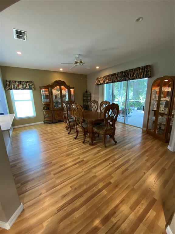 4202 Hammersmith Drive Clermont, FL 34711 - Photo 45 of 73 a living room with furniture and a wooden floor