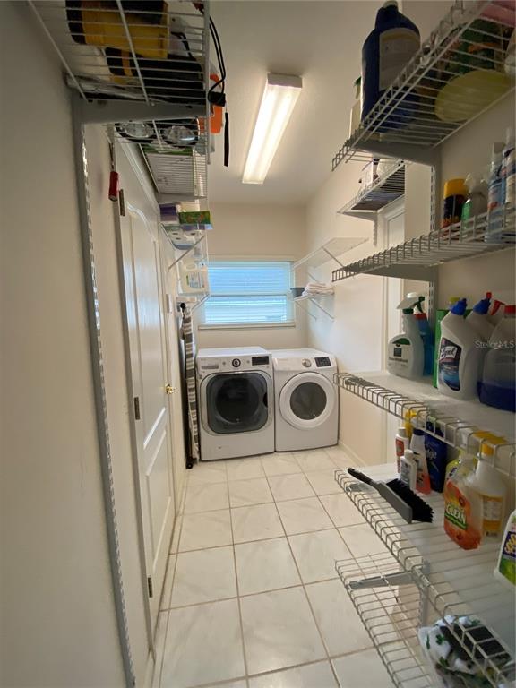 4202 Hammersmith Drive Clermont, FL 34711 - Photo 48 of 73 a utility room with dryer and washer