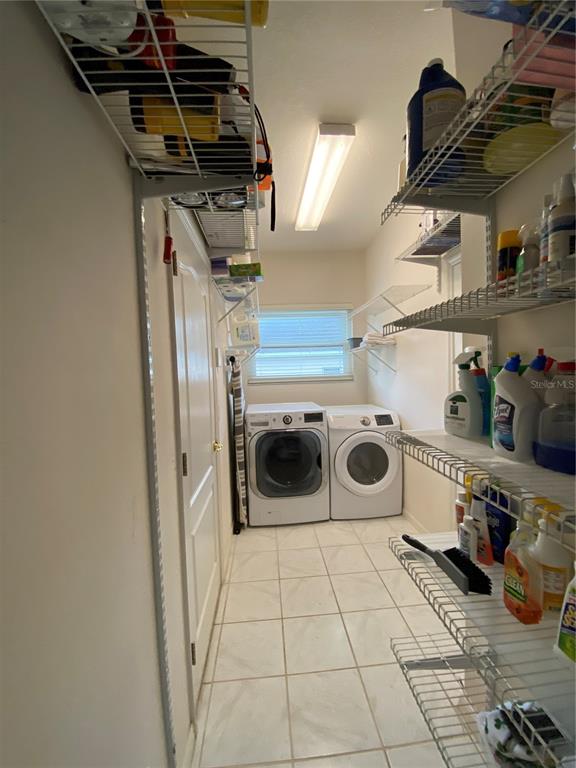 4202 Hammersmith Drive Clermont, FL 34711 - Photo 49 of 73 a utility room with dryer and washer