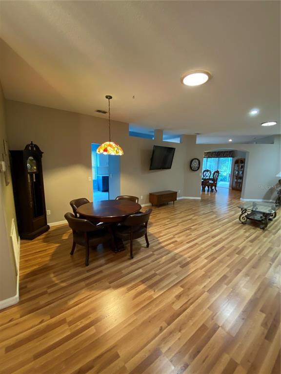 4202 Hammersmith Drive Clermont, FL 34711 - Photo 58 of 73 a living room with furniture and a table