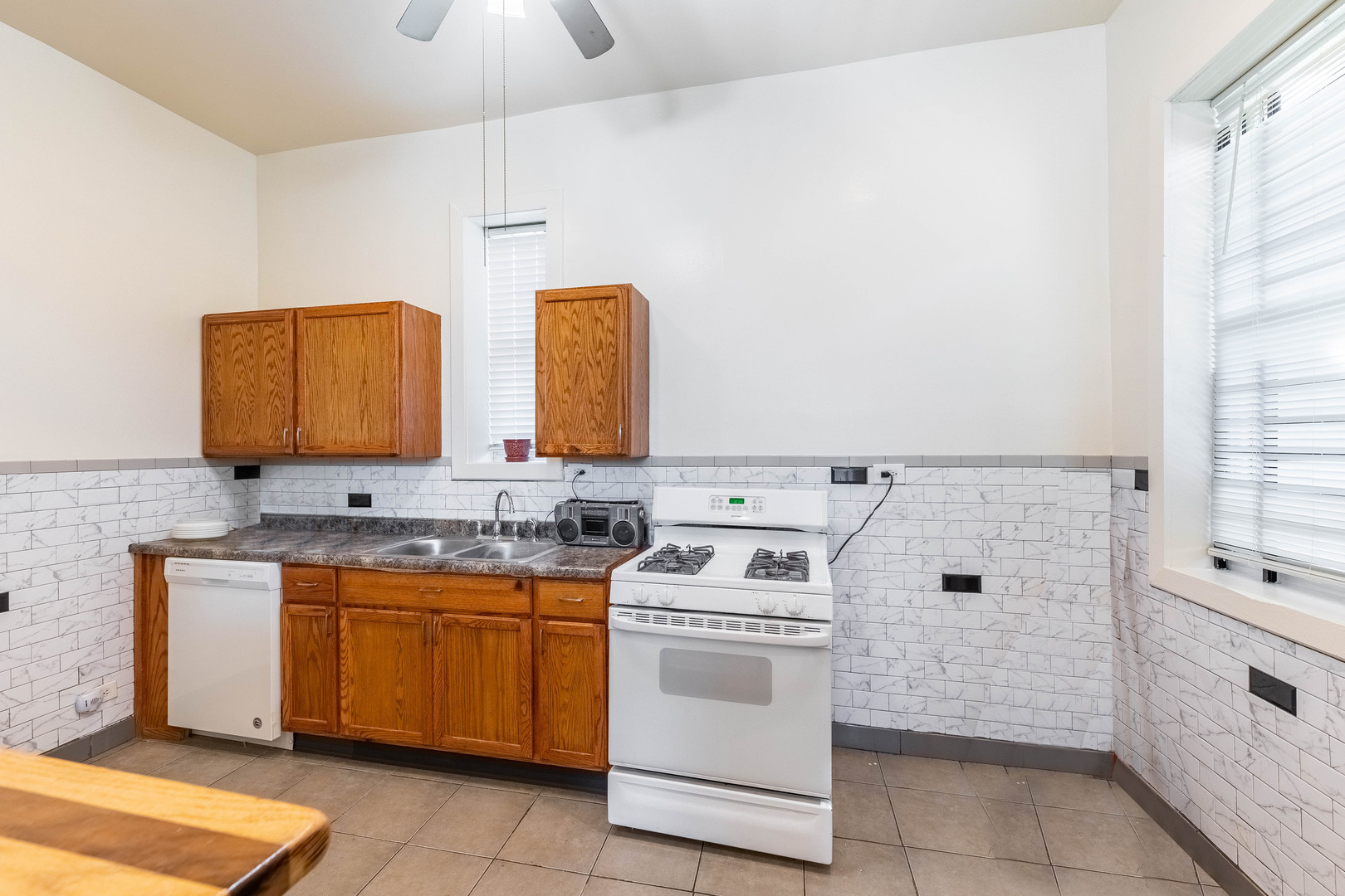 4823 South Indiana Avenue Chicago, IL 60615 - Photo 17 of 30 a view of a kitchen with sink and stove