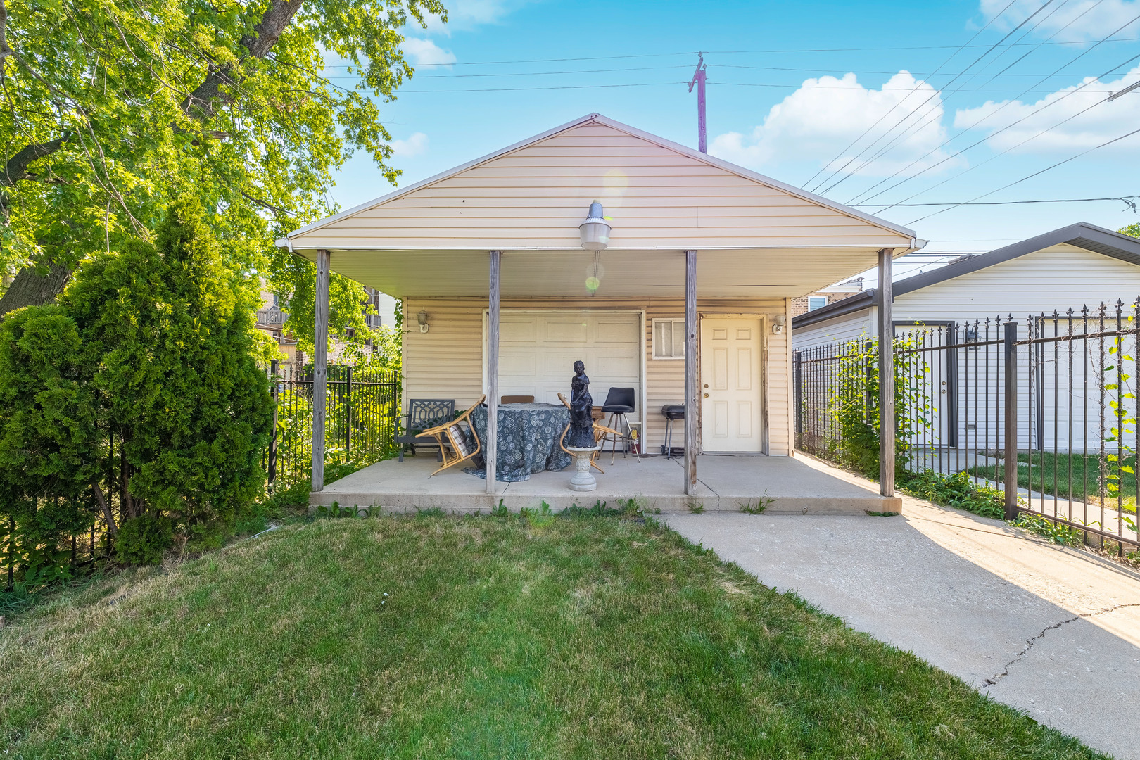 4823 South Indiana Avenue Chicago, IL 60615 - Photo 29 of 30 a patio with table and chairs under an umbrella