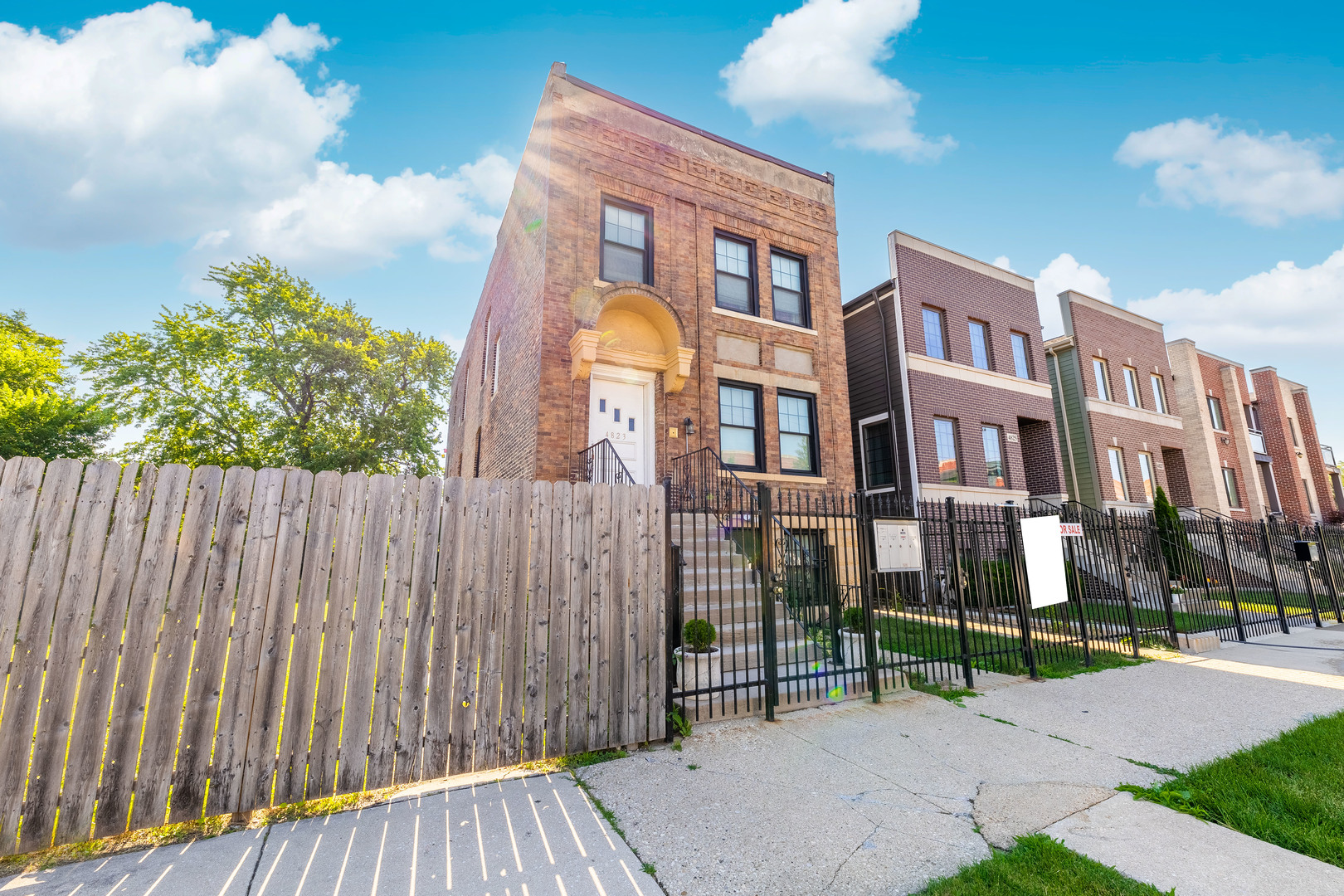 4823 South Indiana Avenue Chicago, IL 60615 - Photo 3 of 30 a view of a brick building next to a yard